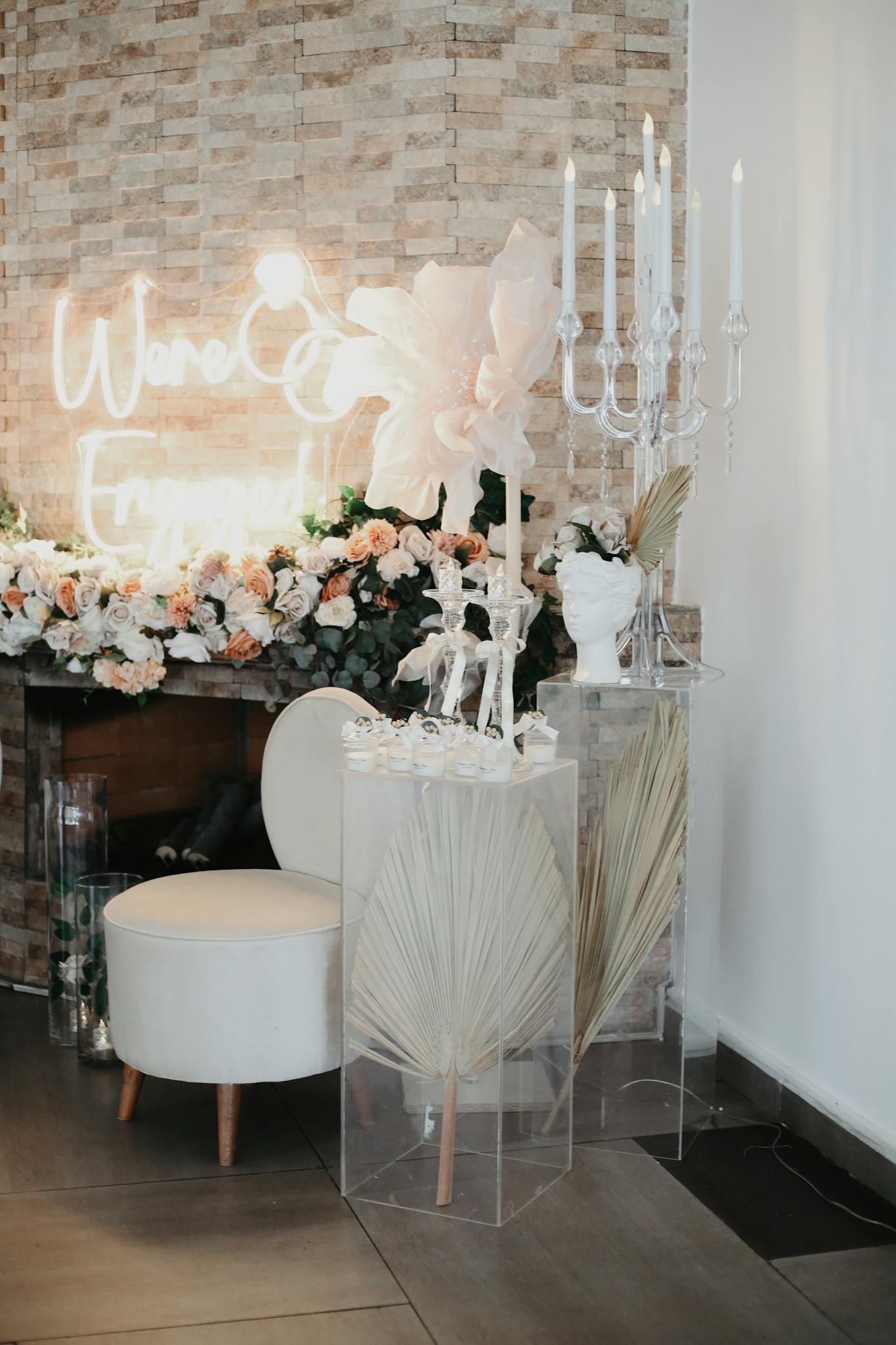A sophisticated wedding decoration featuring flowers, candles, and elegant decor.